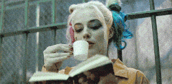 Person reading with colorful hair.