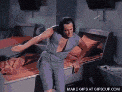 Person dancing in a futuristic room.