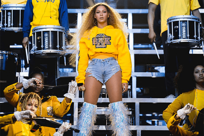 Performer in vibrant stage outfit.