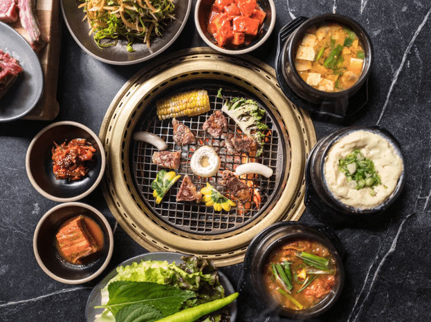 Variety of grilled meats and sides