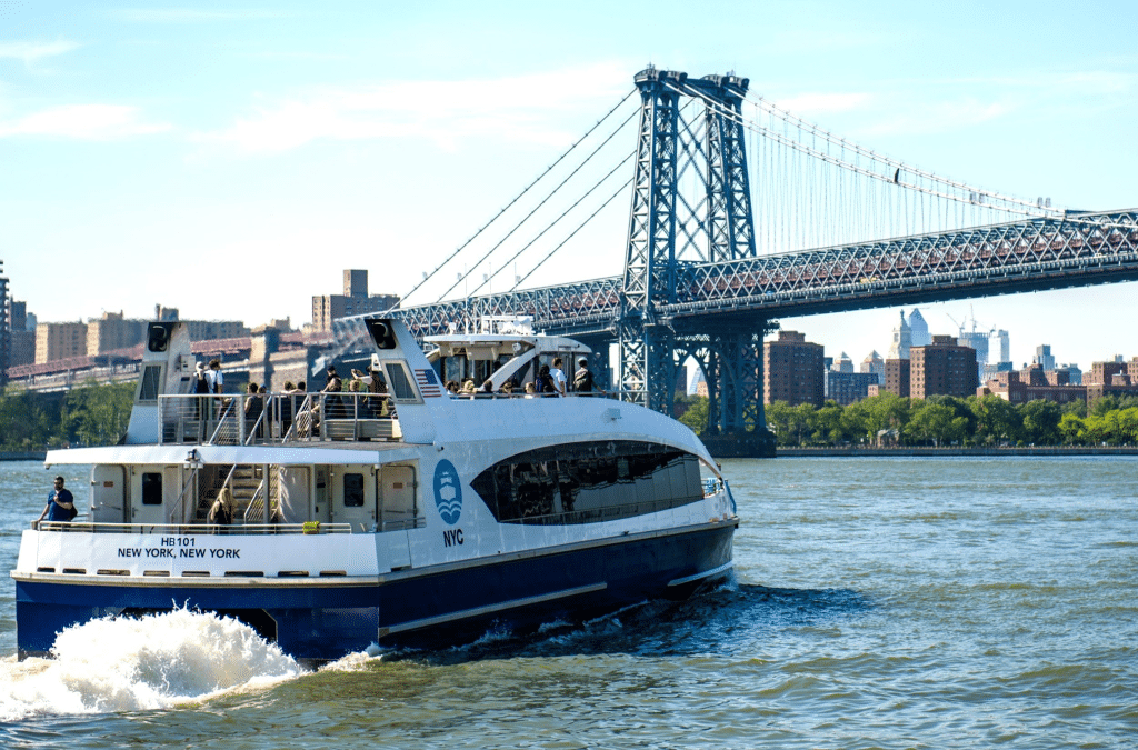 Ferry passing under a bridge.