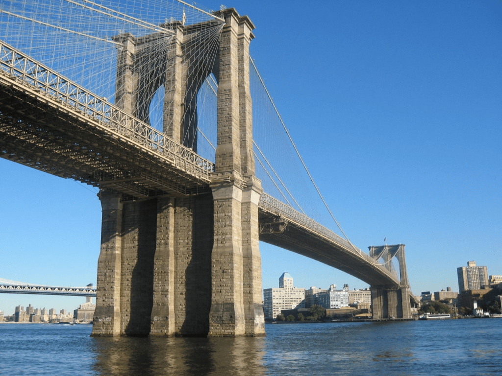 Brooklyn Bridge over calm water