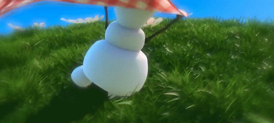 Snowman with umbrella on grass